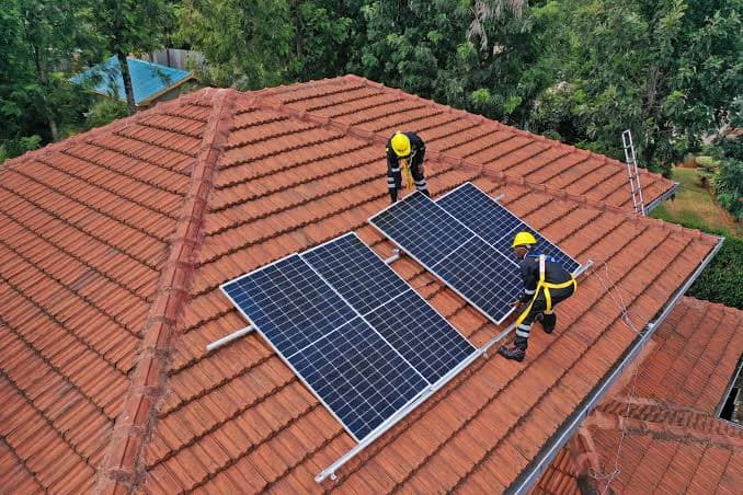 Horizon technicians installing solar panels on a residential roof